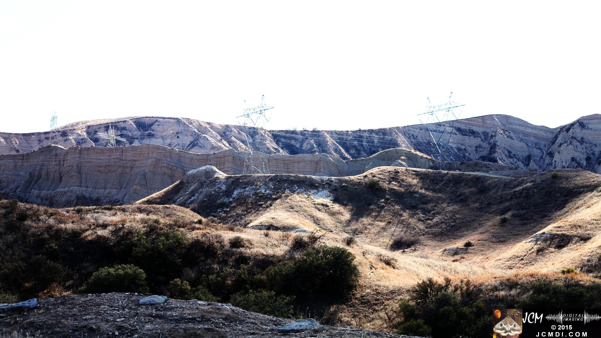Landslide, buckled pavement, and terrain at Vasquez Canyon Road in Santa Clarita, CA filmed 11-25-2015